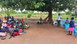 Miners in Uganda interacting with local government officials during a technical support visit. The Programme works with local government officials to limit service gaps for miners.