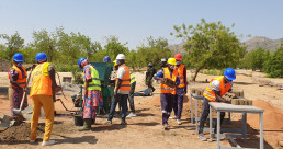Youth and women producing stabilized earth bricks with AJDEC youth association in Mora, Far North Cameroon