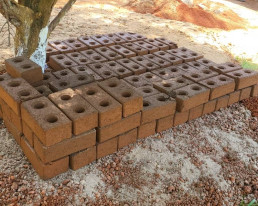 Stabilized earth bricks made by participants during a training in Belabo