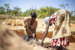 Artisanal and small-scale miner sieving sand for construction at a mining site in Kitwe, Zambia