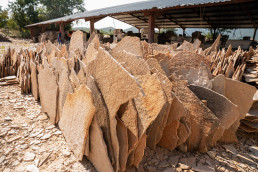Flat dimension stones used for construction displayed at a roadside in Lusaka, Zambia