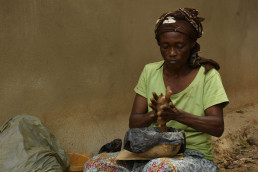 Woman artisan making pottery from local clay in Foumban