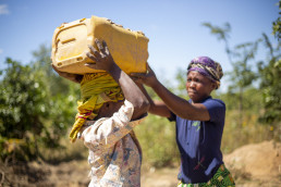 Artisanal and small-scale miner sieving sand for construction at a mining site in Kitwe, Zambia