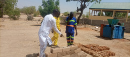 Youth producing stabilized earth bricks with AJDEC youth association in Mora, Far North Cameroon