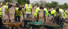 Youth and women use clay mixed with 8% cement for producing stabilized earth bricks with AJDEC Youth Association in Mora, Far North Cameroon