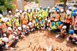 Trainees testing material quality in plastic bottles