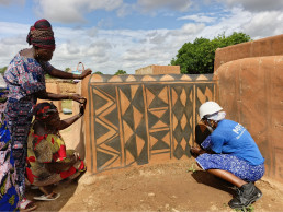 Women mural painters at work
