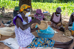 Women pottery makers gving finishing touch