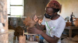 an employee mentored by artisan Robert Campbell of Hands in Clay (now Khadabra)