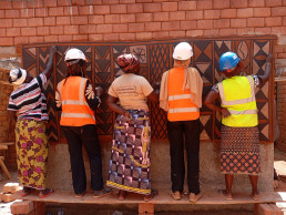 Tiébélé women applying the traditional mural painting on the LCM demonstration building in Ouagadougou