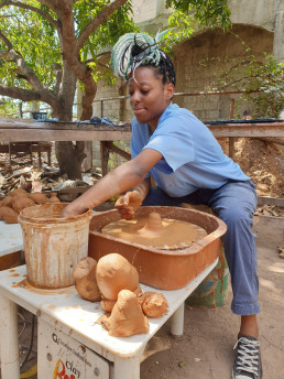 An employee being trained at the studio of Artisan Robert Campbell of Hands in Clay (now Khadabra)