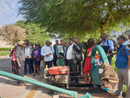 Outside the exhibition, participant gathered to see the demonstration of the stone crusher – a key equipment for artisanal miners – manufactured in Zambia by entrepreneur Victor Pikiti