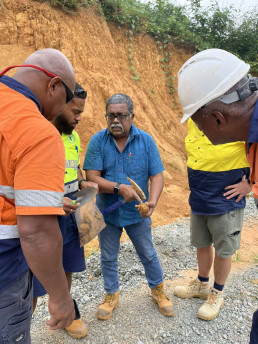 Dr Soumen Maity (TARA) explaining the clay properties to the team at Flame Tree site, Saru, Lautoka