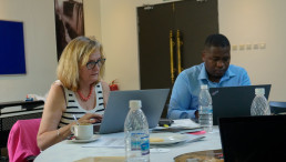 Participants work on draft text during a chapter writing session.