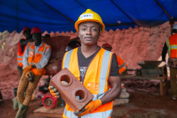 Worker holding a finished brick
