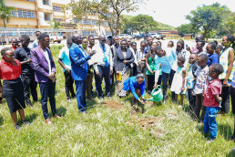 A symbolic tree-planting activity was held to emphasize environmental restoration in mining areas, involving Ms. Naomi Nangoku, Vice Chancellor Prof. Paul Waako, and Deputy Vice Chancellor Assoc. Prof. Biira Saphina.