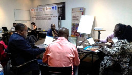 Participants work on draft text during a chapter writing session.