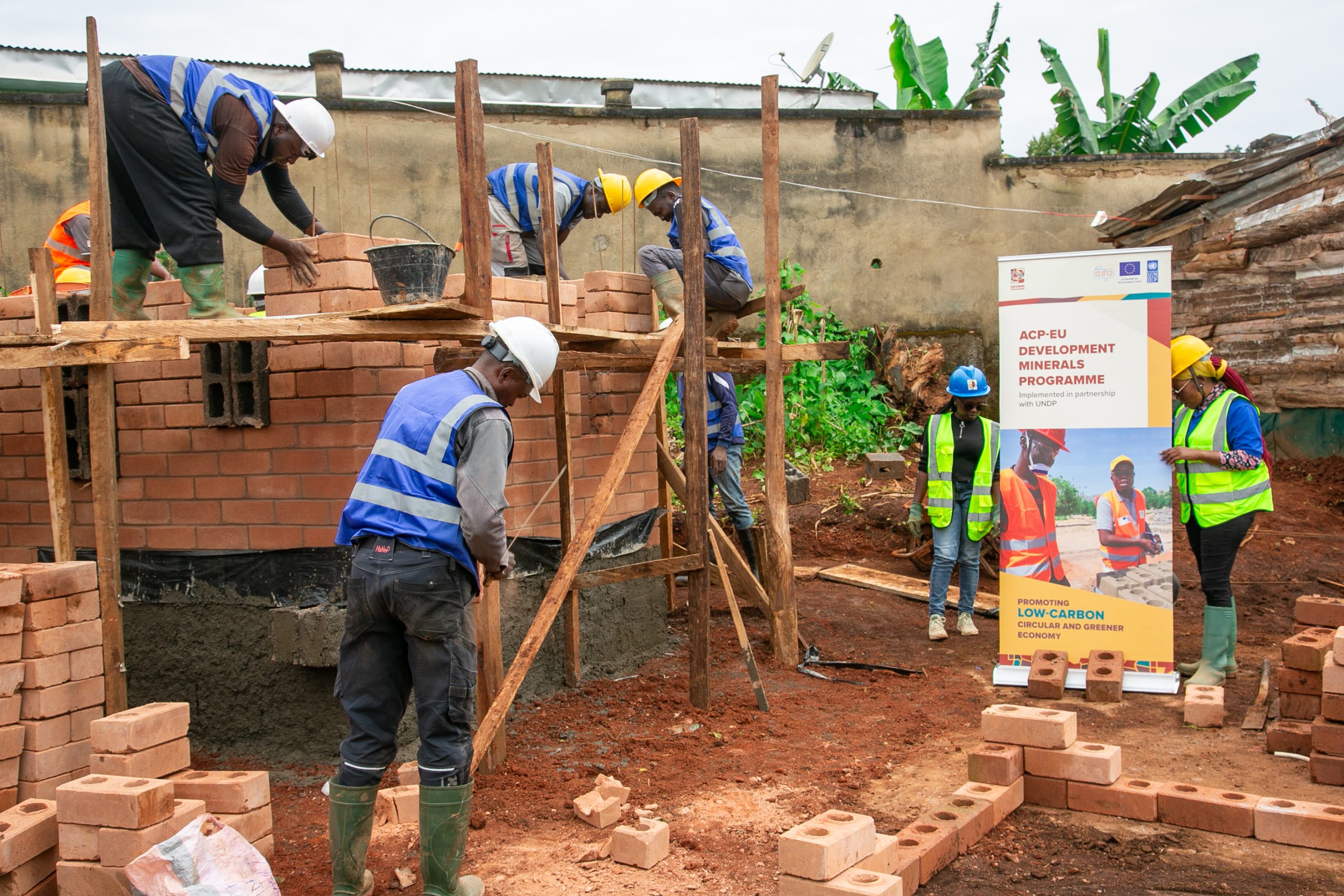 Trainees construct a demonstration structure using stabilized earth bricks (SEB) on the University of Dschang campus during the ACP–EU Development Minerals Programme’s practical session on eco-construction Photo credit: UNDP Cameroon