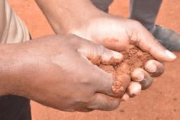 Demonstration a simple soil test to identify the ideal soil for producing stabilized earth bricks with minimal cement.