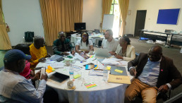 Participants work in small groups to organize topics and refine chapter outlines.