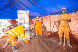 Mixing the soil blend used to make the bricks