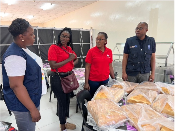 Mission team with the CEO and COO of FMS Bakery and restaurant in Kitwe, with some of the products from their bakery displayed on the table. FMS is one of the shortlisted SDP suppliers based in Kitwe. Photo credit: UNDP Zambia