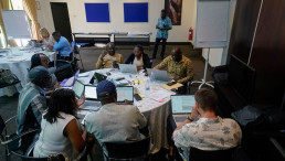 Participants work in small groups to organize topics and refine chapter outlines.