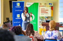An indoor session facilitated by Ms. Kermudu Peace, Branch Manager at Gulu University, delivering an engaging presentation on financial literacy