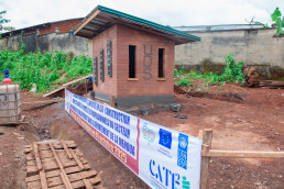 Wide view of the gatehouse built by trained students