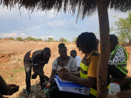 Government officials interacting with artisanal and small-scale miners during a formalization mission in Zambia.