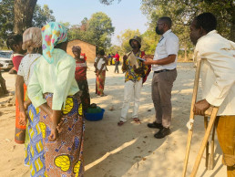 The Country Coordinator and government officials during a formalization mission in Zambia.