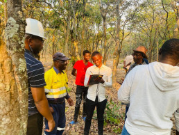 The Country Coordinator and government officials during a formalization mission in Zambia.