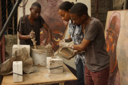 Young artisans honing their skills in ceramic pottery making during a workshop in Kingston, Jamaica